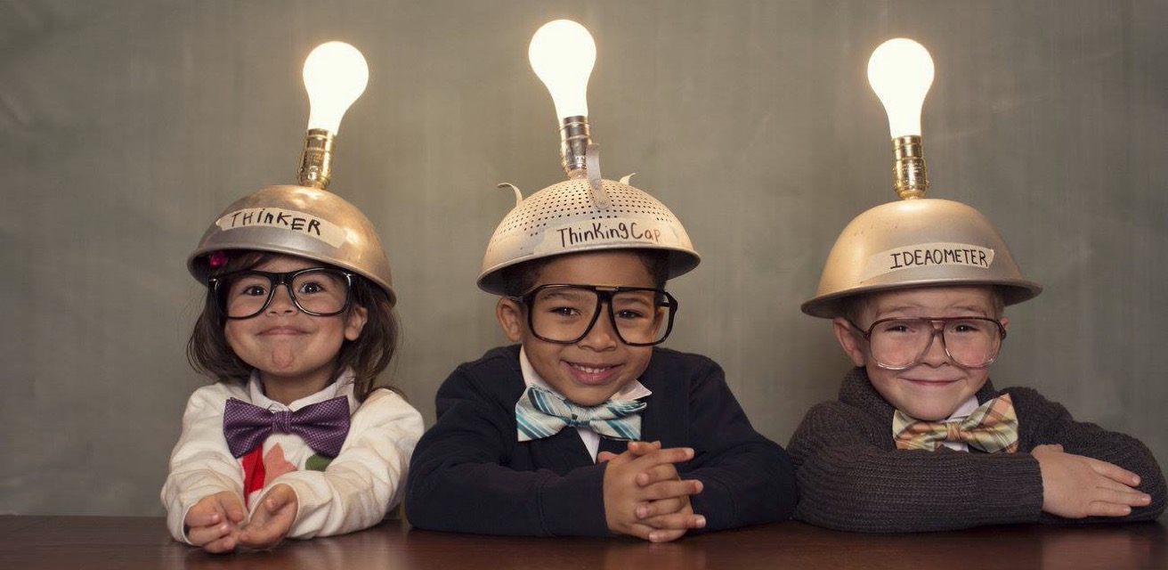 three children wearing hats with light bulbs